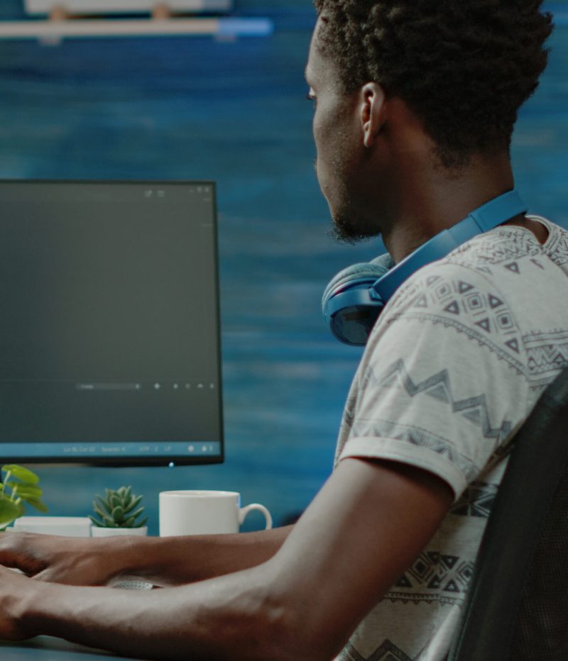 Programmer using binary code for website interface development on computer. Person coding system for cybersecurity with firewall data. Coder programming security for software app