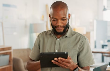 web12 Tablet, office and business black man with digital marketing, company asset management and startup .