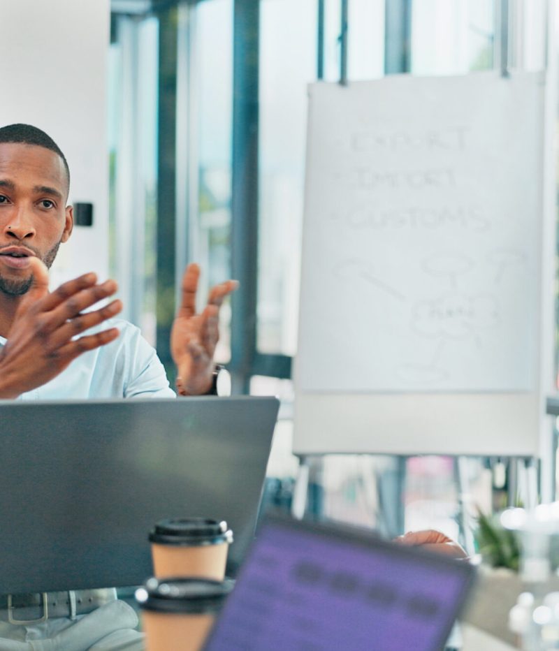 Corporate, black man and team in meeting, brainstorming and feedback for new project, discussion an.